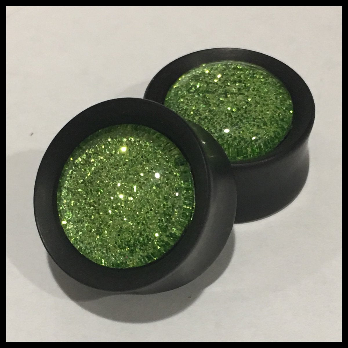 Ebony Sparkle Green Round Plugs